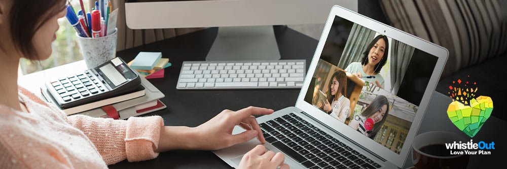 Woman video conferencing at desk