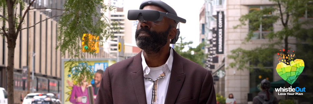 Vision-impaired man walking down the street wearing eSight eyewear Vision-impaired man walking down the street wearing eSight eyewear