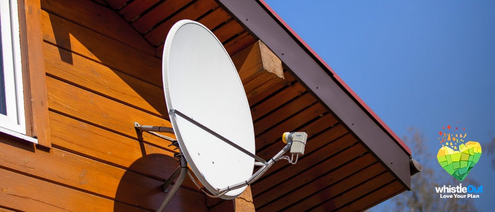 A satellite TV dish on a cabin